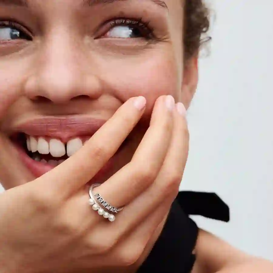 Sterling silver open ring with white treated freshwater cultured pearl and clear cubic zirconia