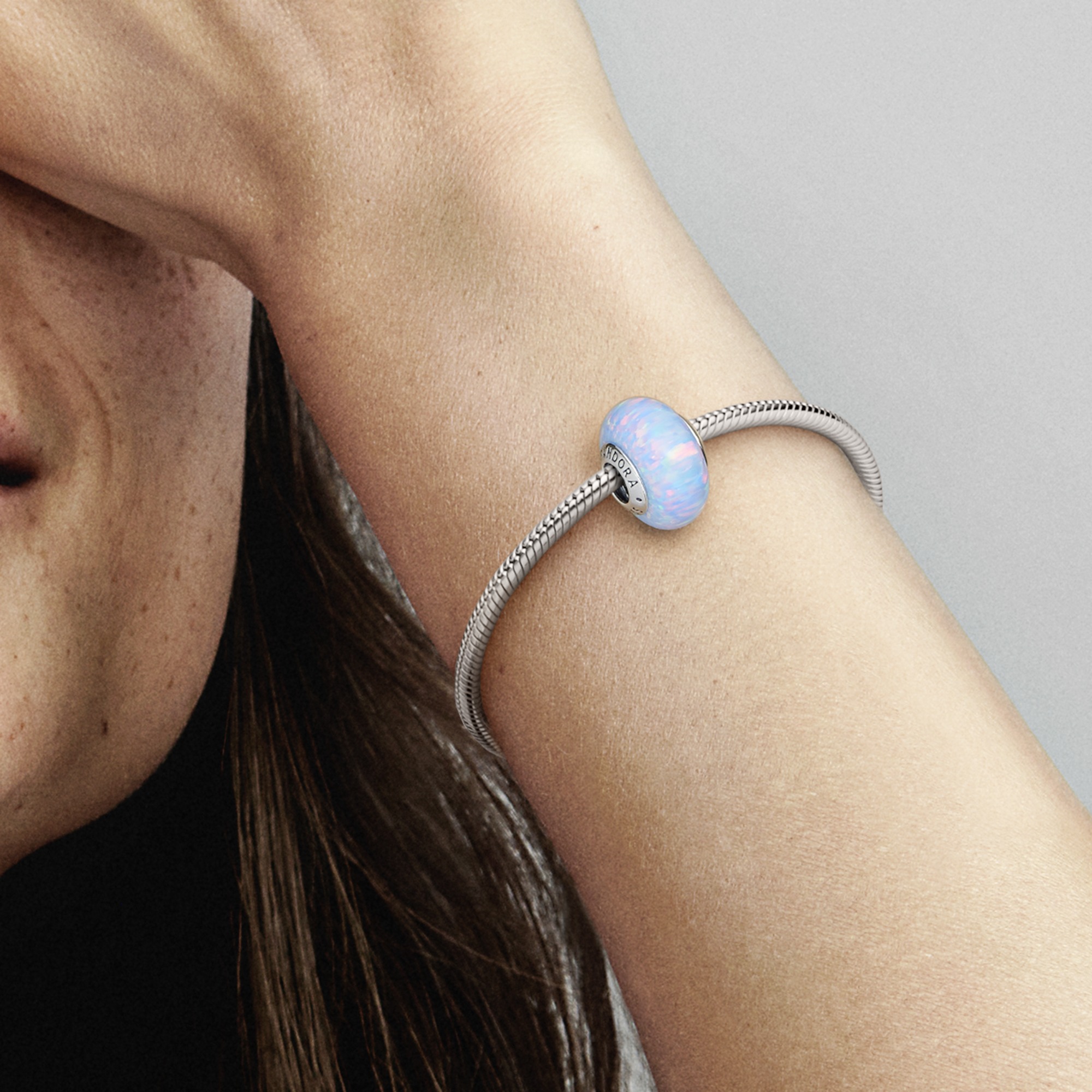 Sterling silver charm with light blue lab-created 