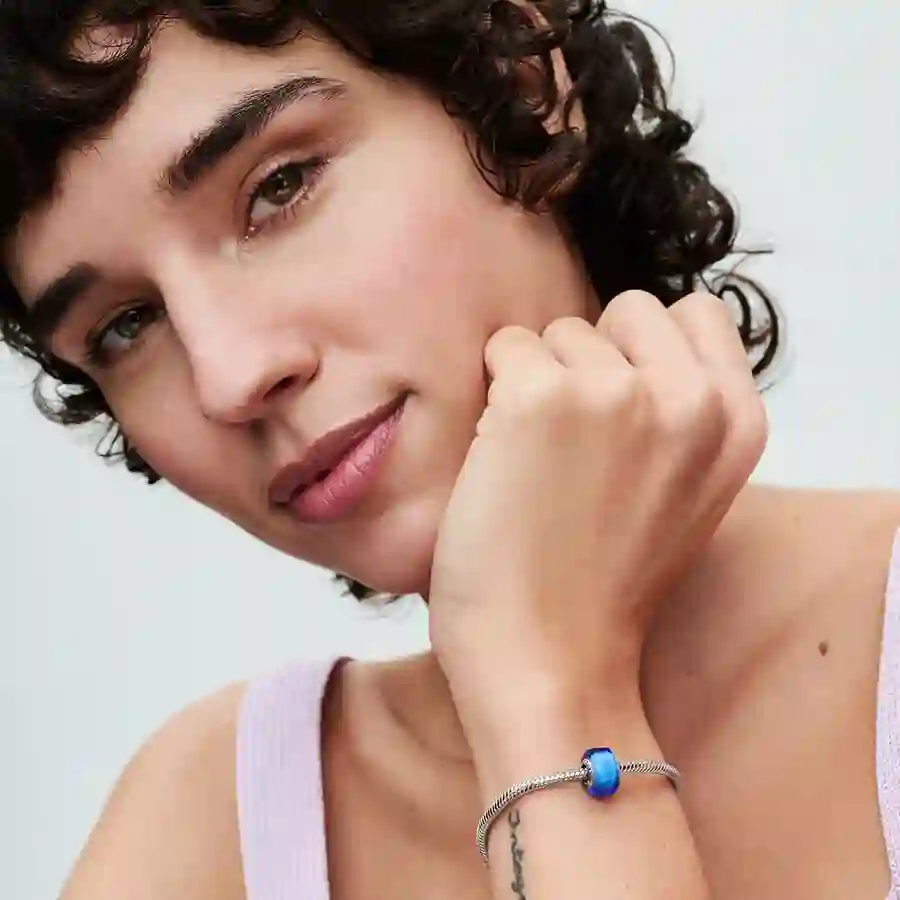 Sterling silver charm with blue Murano glass