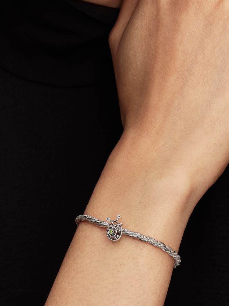 Snail sterling silver charm with light green cryst