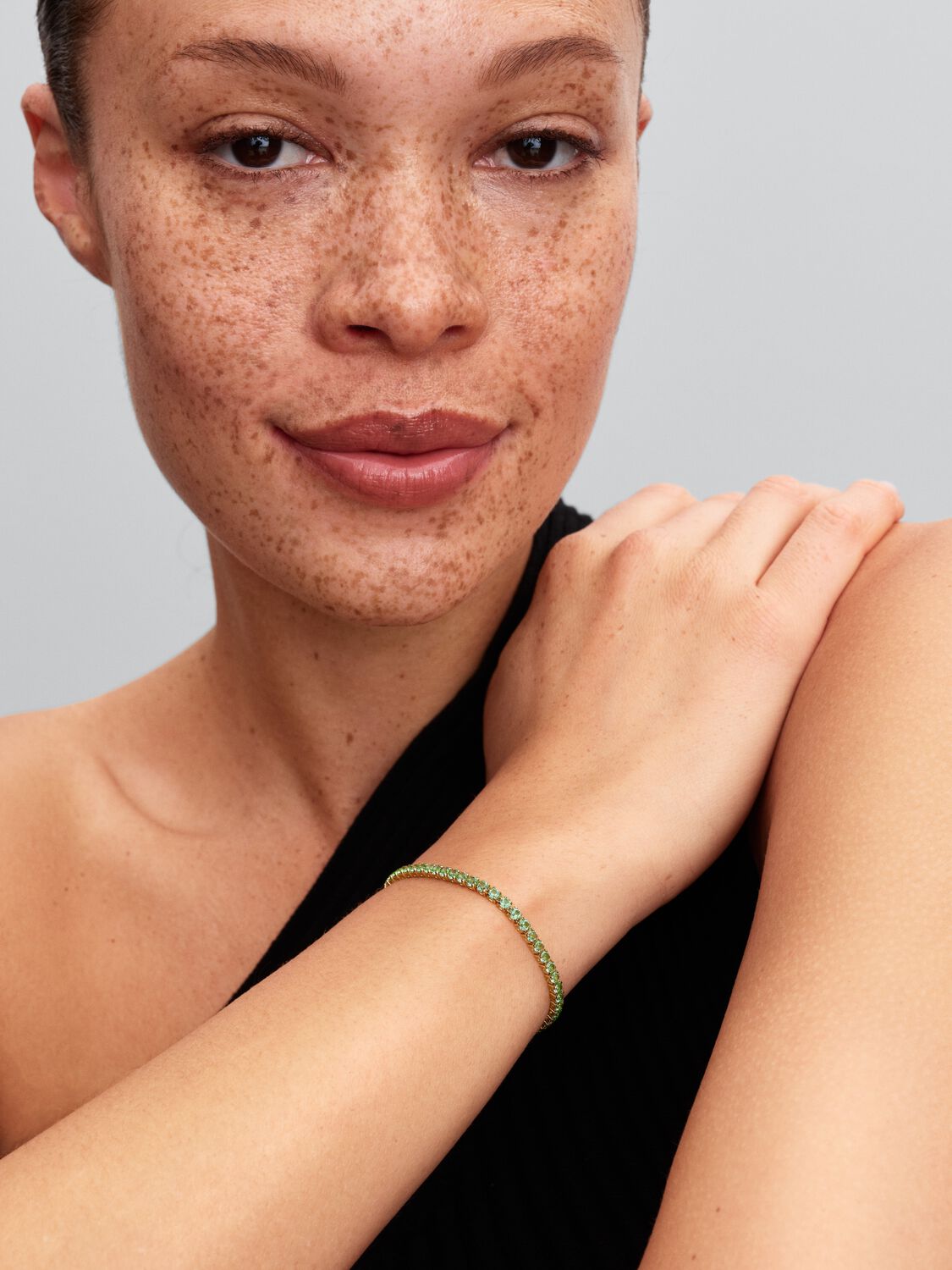 14k gold-plated bracelet with mint green crystal