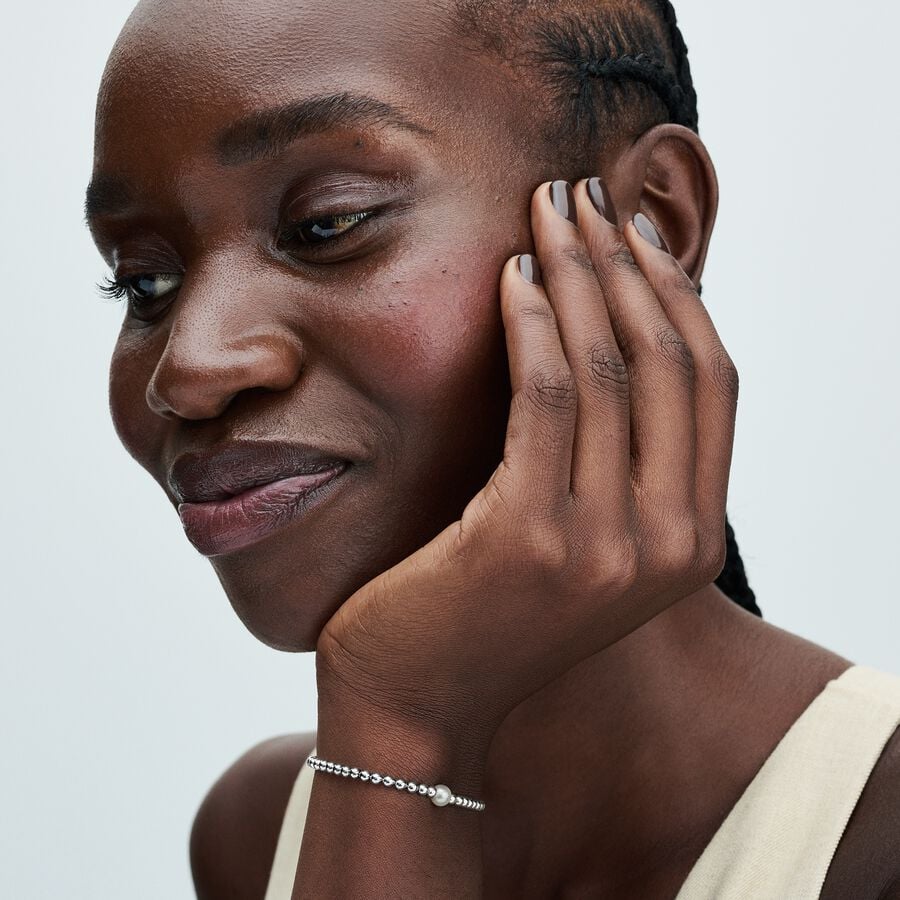 Beaded sterling silver bracelet with white treated freshwater cultured pearl and clear cubic zirconi