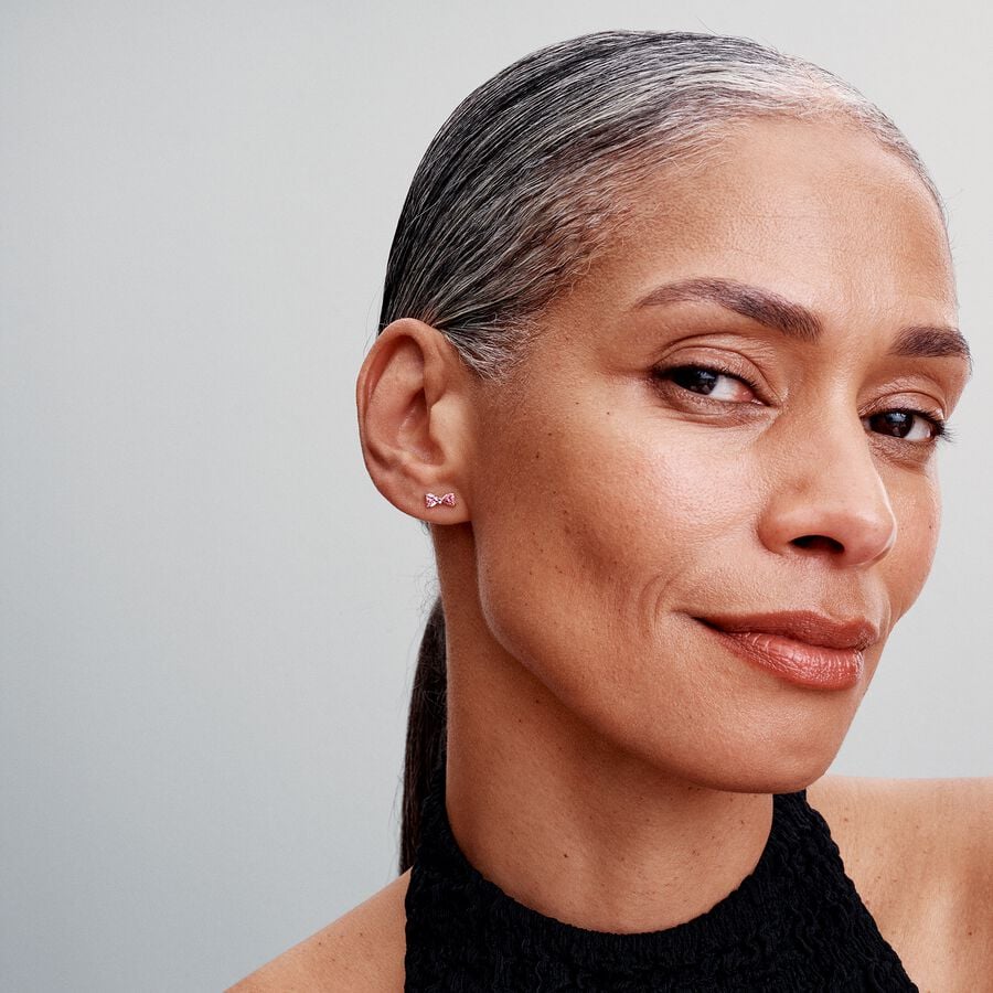 Bow sterling silver stud earrings with fancy pink 