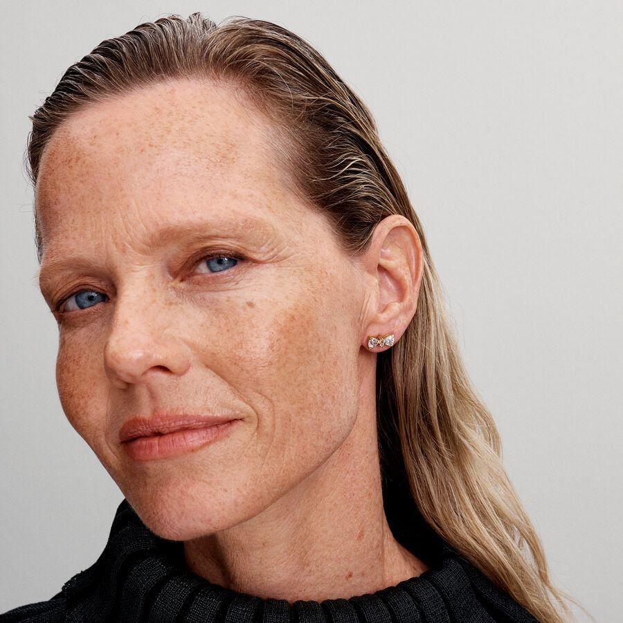 Bow 14k gold-plated stud earrings with clear cubic