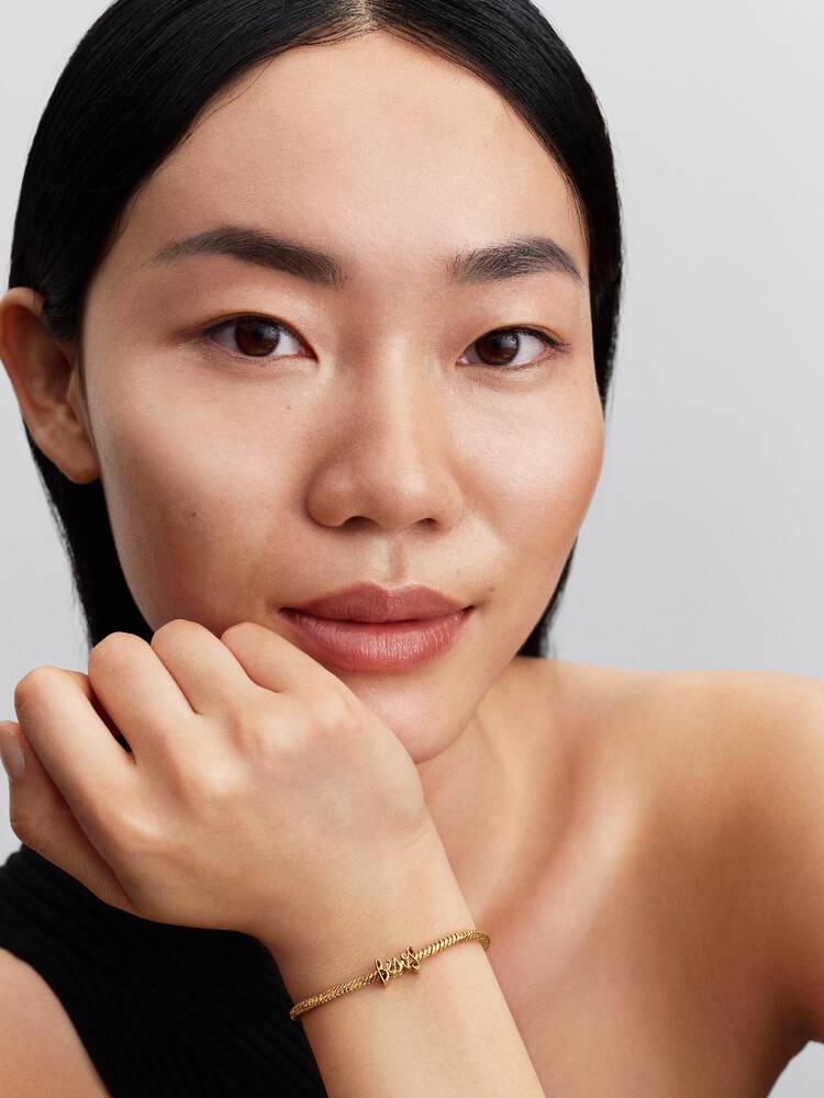 Besos 14k gold-plated charm