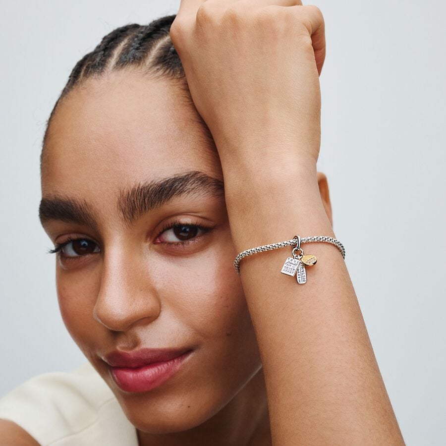 Friendship sterling silver and 14k gold-plated dangle with clear cubic zirconia