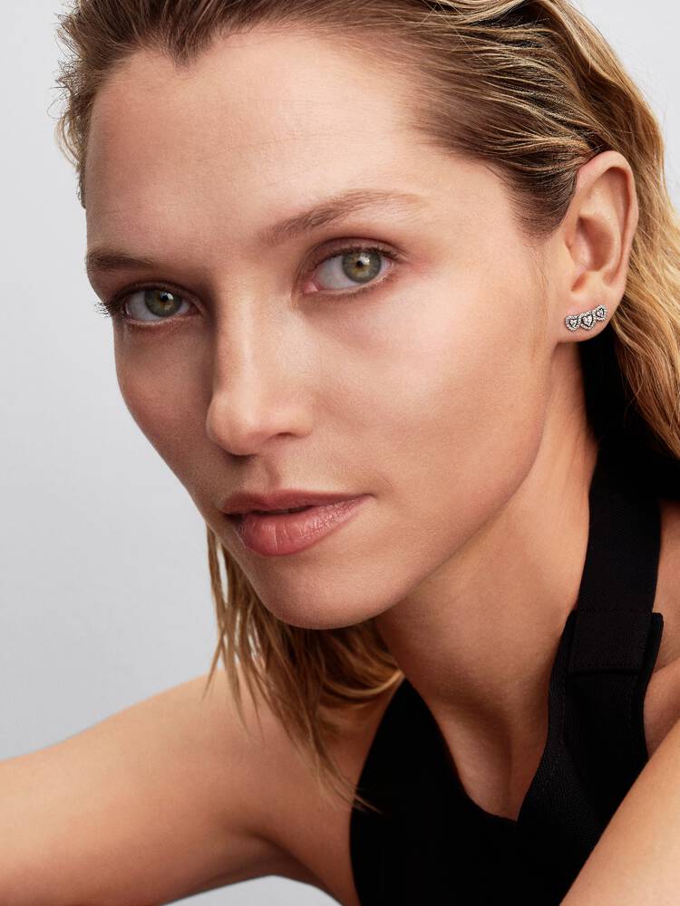 Triple heart sterling silver stud earrings with cl