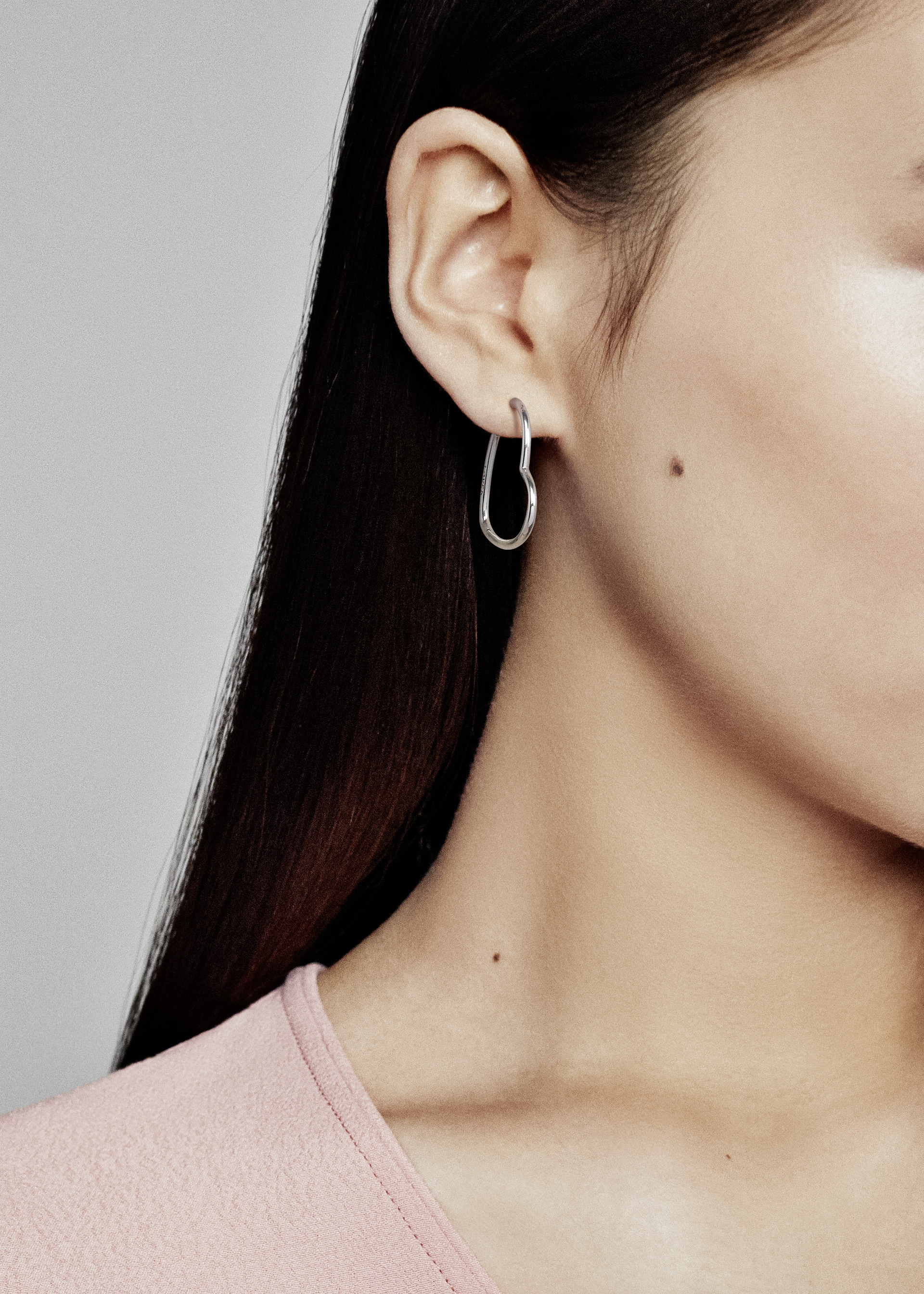 Asymmetrical heart silver hoop earrings
