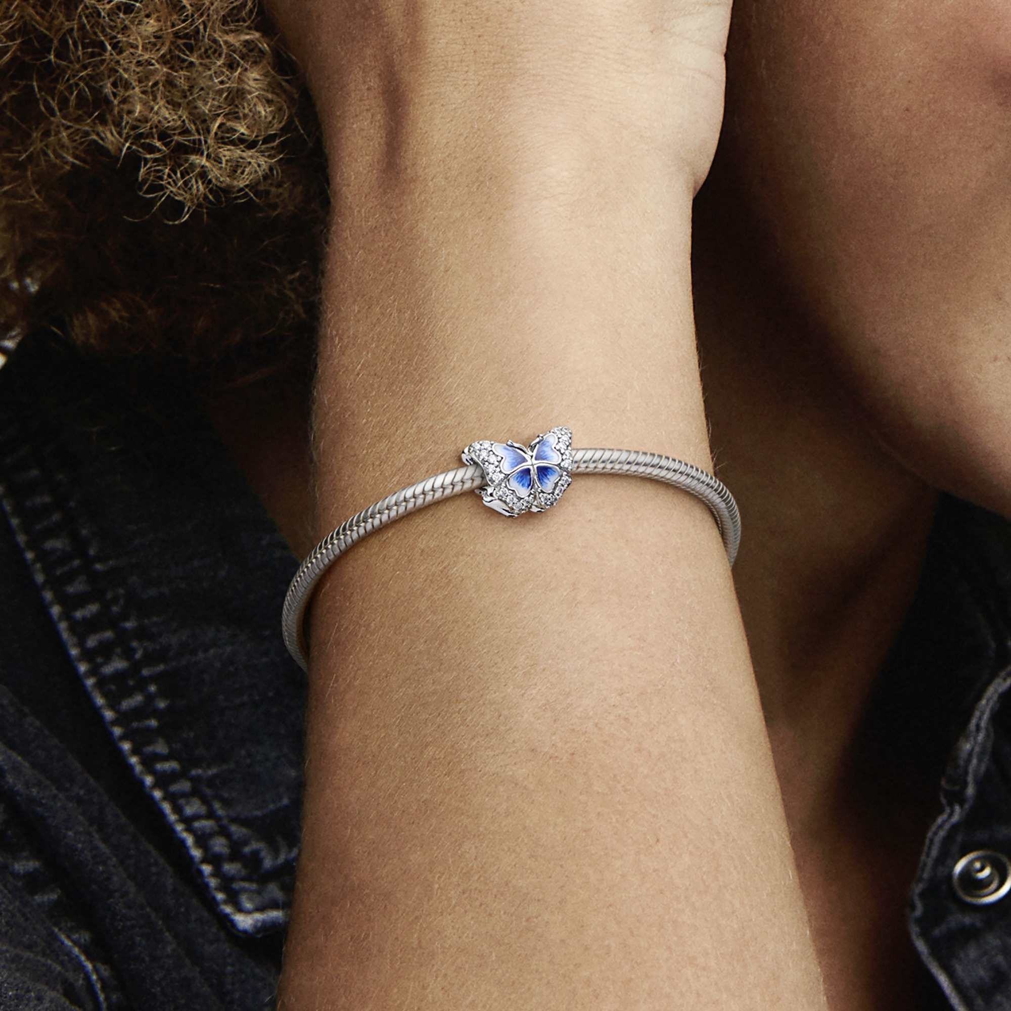Butterfly sterling silver charm with clear cubic zirconia and shaded blue and white enamel